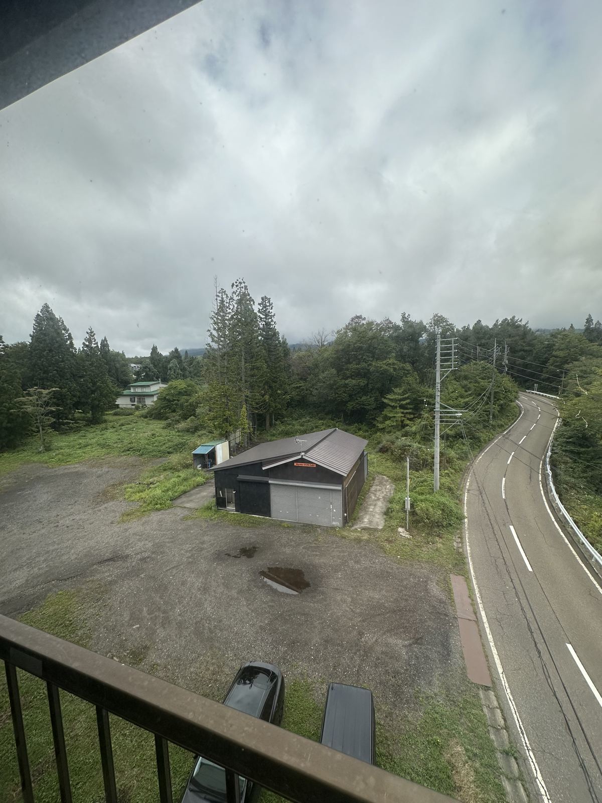 View from balcony over the road and land